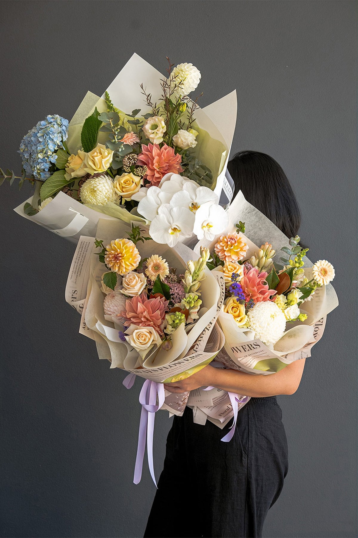 A unique, handcrafted florist's choice bouquet by GoBush, features fresh seasonal flowers and lush foliage available in Brisbane."